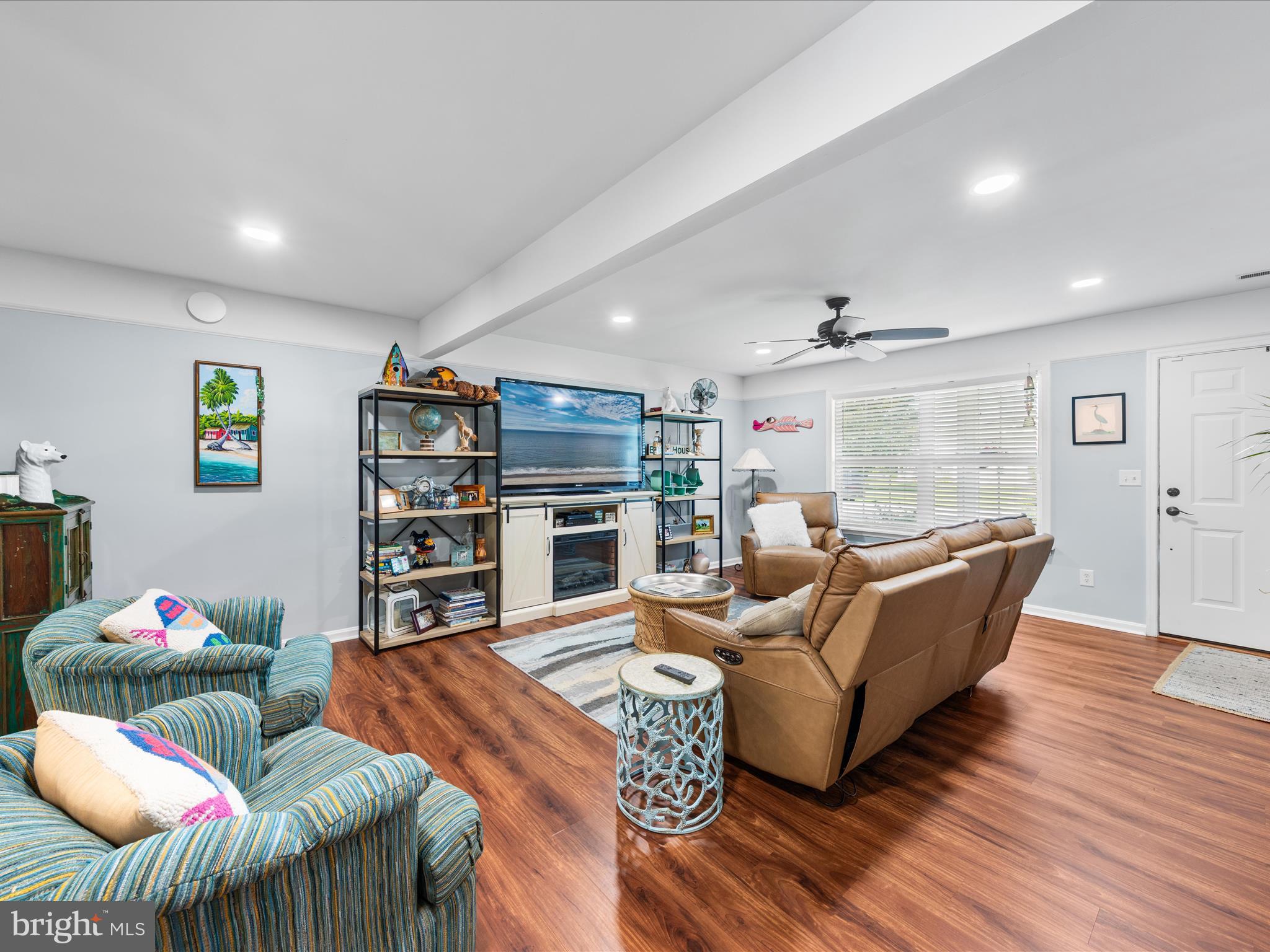16869 West Randor Drive Milton, DE 19968 - Photo 8 of 76 a living room with furniture a dining table and kitchen view