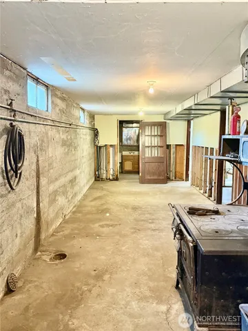 a view of a kitchen with furniture and a stove