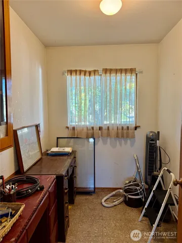 a room with furniture and a window