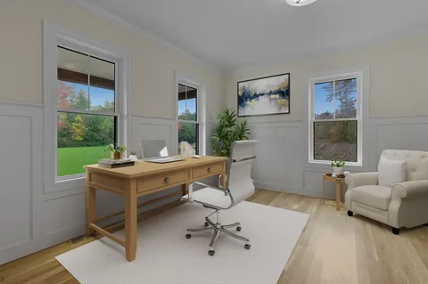 a workspace with furniture and a window