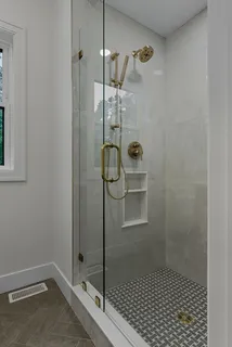 a bathroom with a shower and toilet
