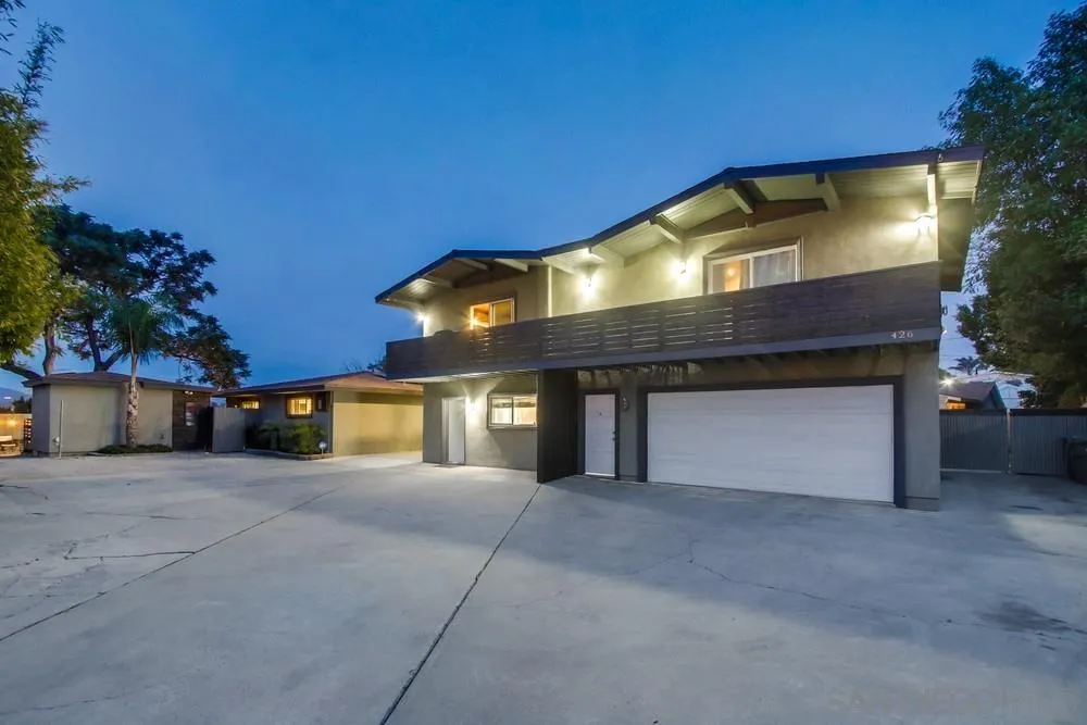 426 Phillips Way Vista, CA 92083 - Photo 5 of 74 a front view of a house with a yard and garage