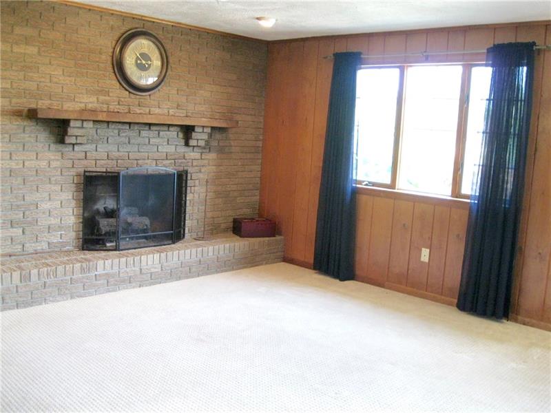 125 Mellingertown Road Mount Pleasant, PA 15666 - Photo 4 of 25 FAMILY HAS A GAS FIREPLACE THAT CAN EASILY BE CONVERTED INTO WOOD BURNING AS WELL.