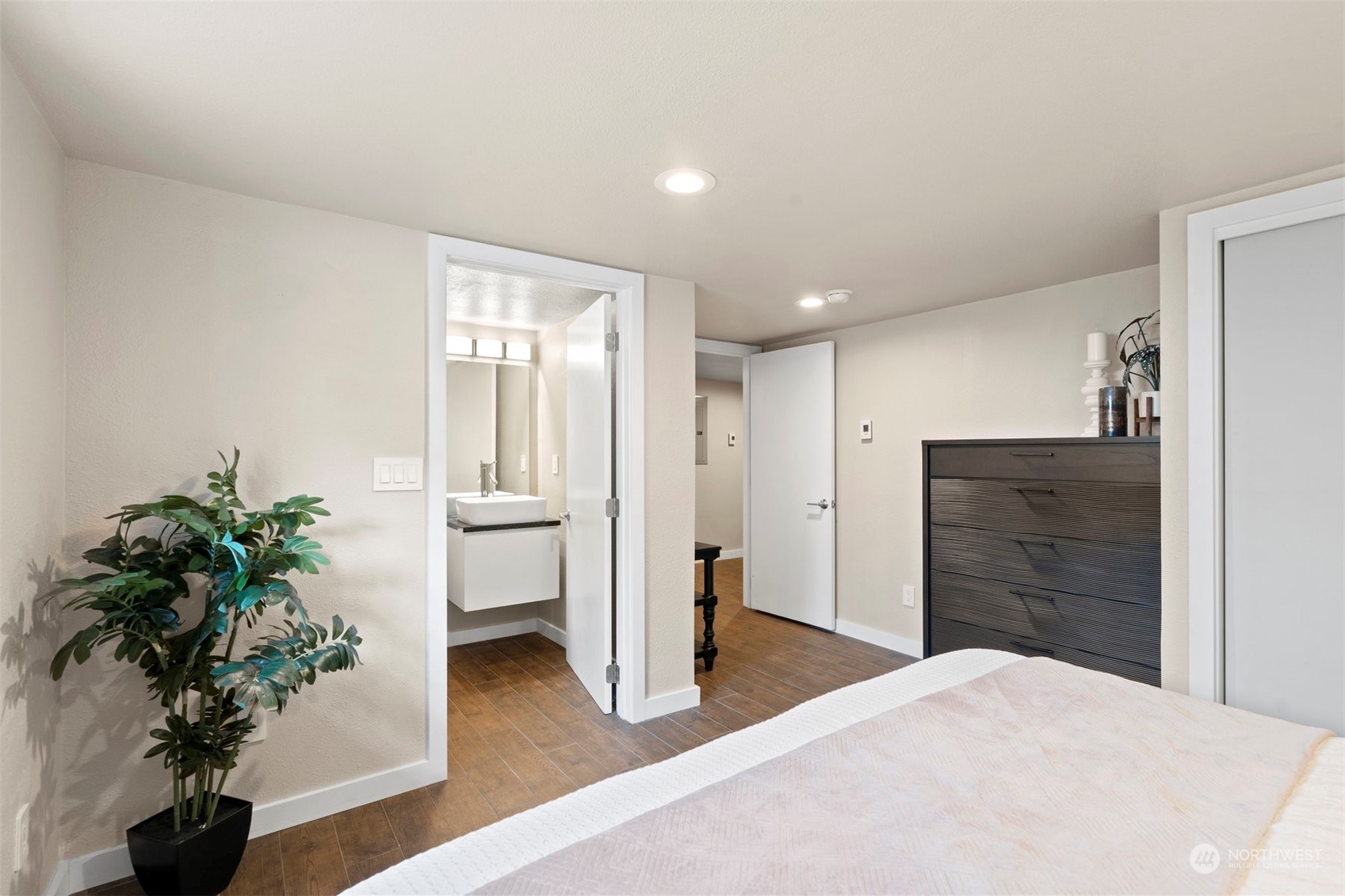 820 North 60th Street Seattle, WA 98103 - Photo 21 of 30 a room with a potted plant and a wooden floor