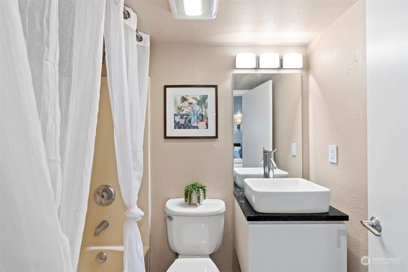 820 North 60th Street Seattle, WA 98103 - Photo 22 of 30 a bathroom with a toilet sink and mirror