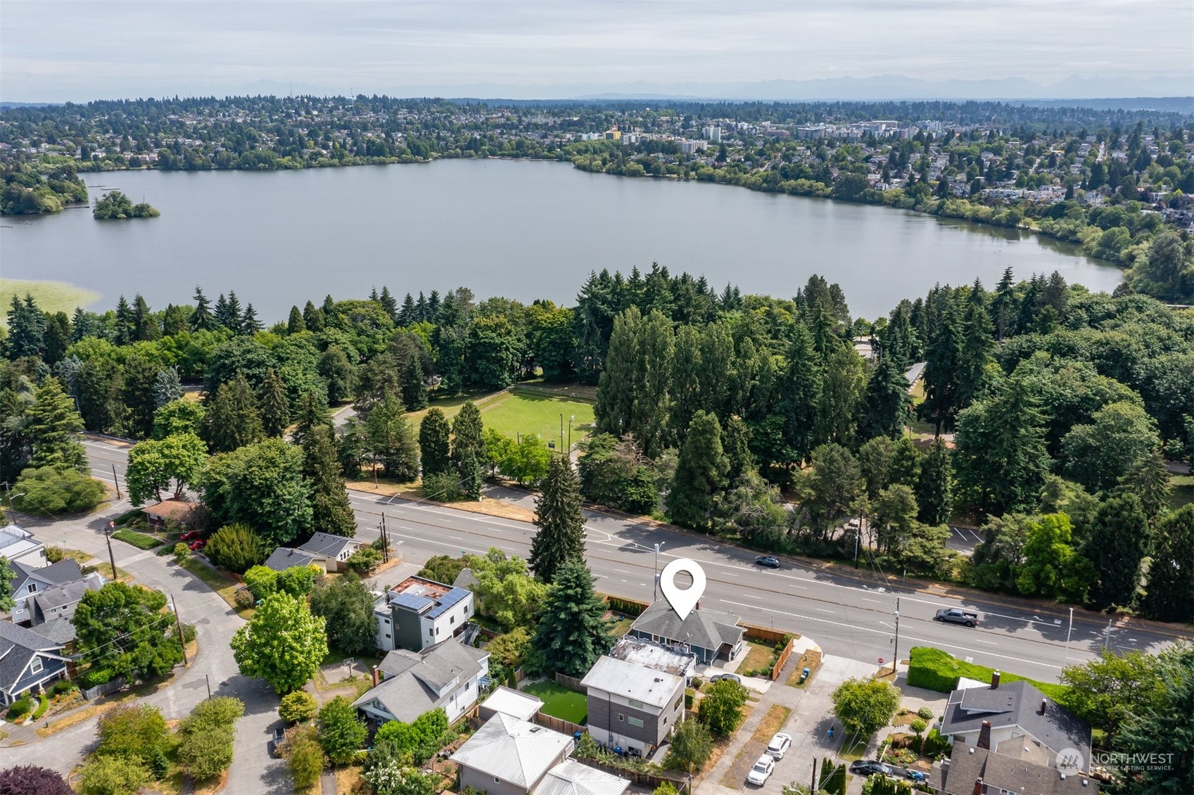 820 North 60th Street Seattle, WA 98103 - Photo 25 of 30 an aerial view of a residential houses with outdoor space and lake view