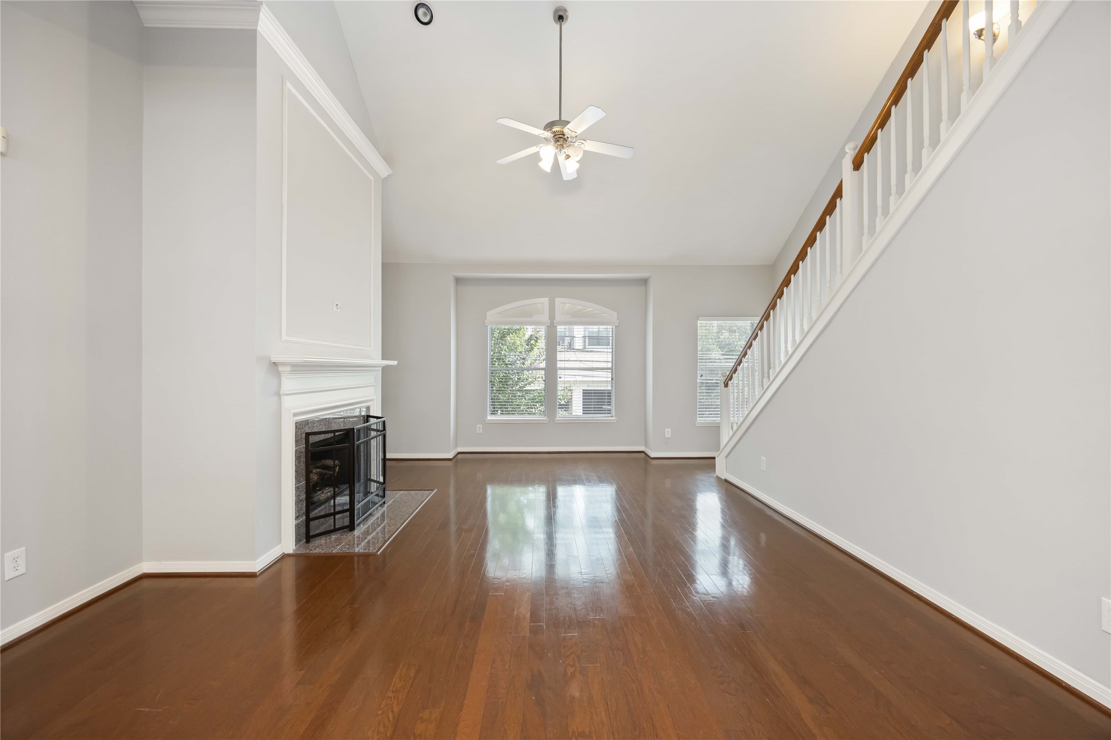 2909 West Dallas Street Houston, TX 77019 - Photo 12 of 39 a view of an empty room with wooden floor fireplace and a window