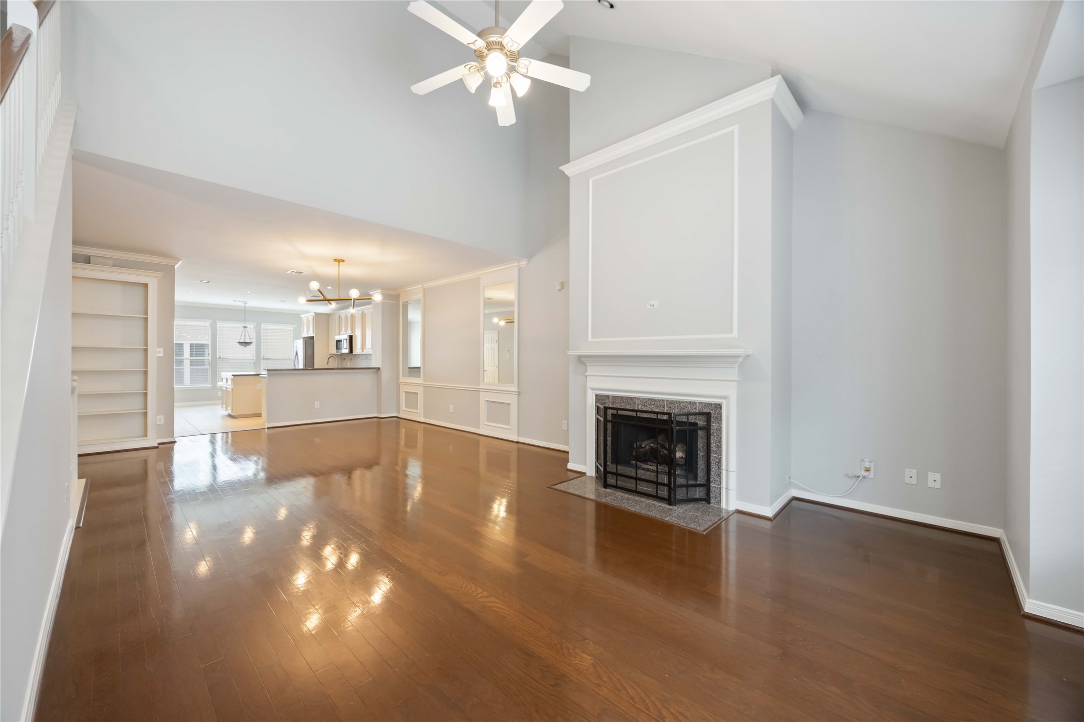2909 West Dallas Street Houston, TX 77019 - Photo 15 of 39 a view of a livingroom with a fireplace a chandelier and windows