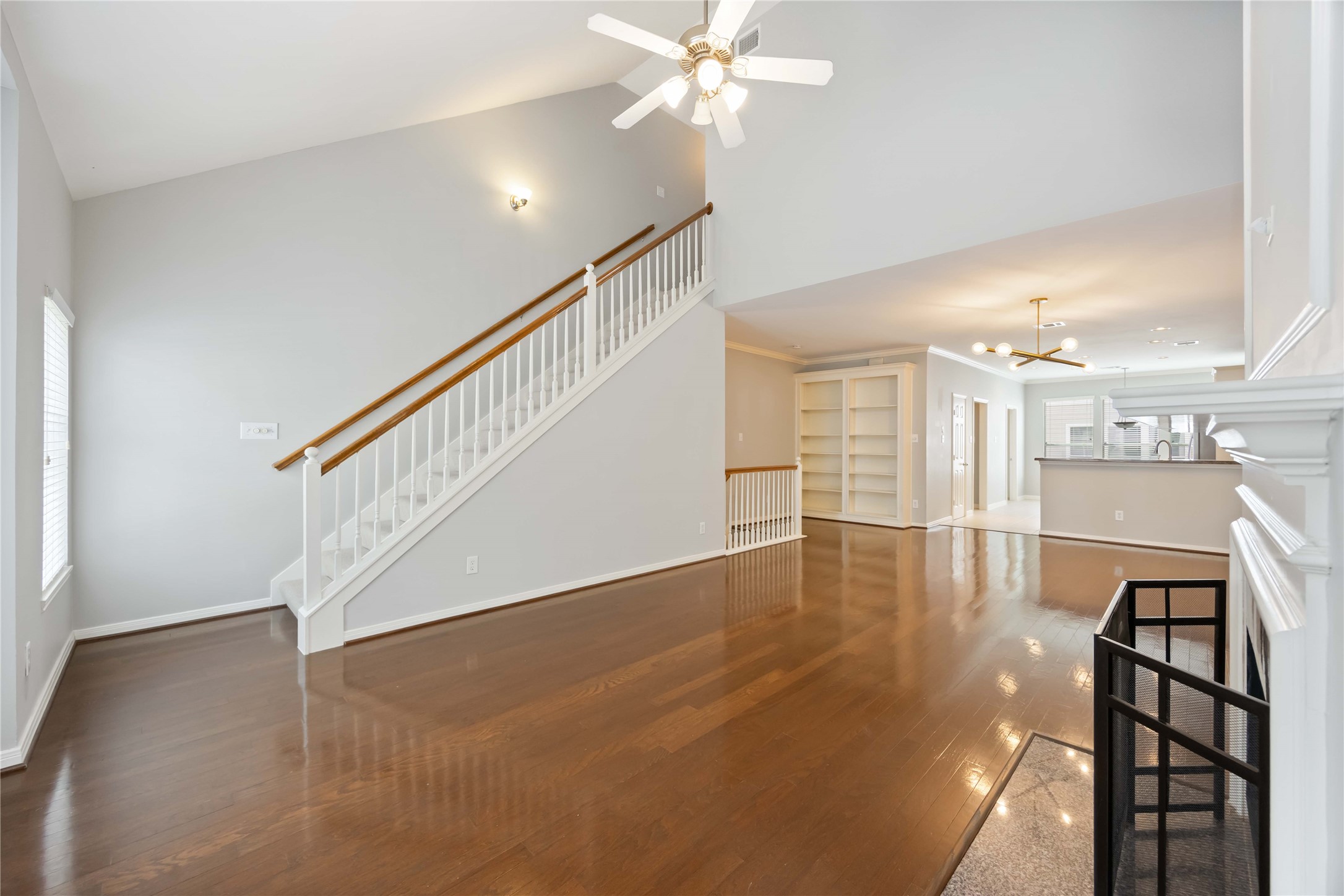 2909 West Dallas Street Houston, TX 77019 - Photo 16 of 39 a view of a livingroom with wooden floor and staircase