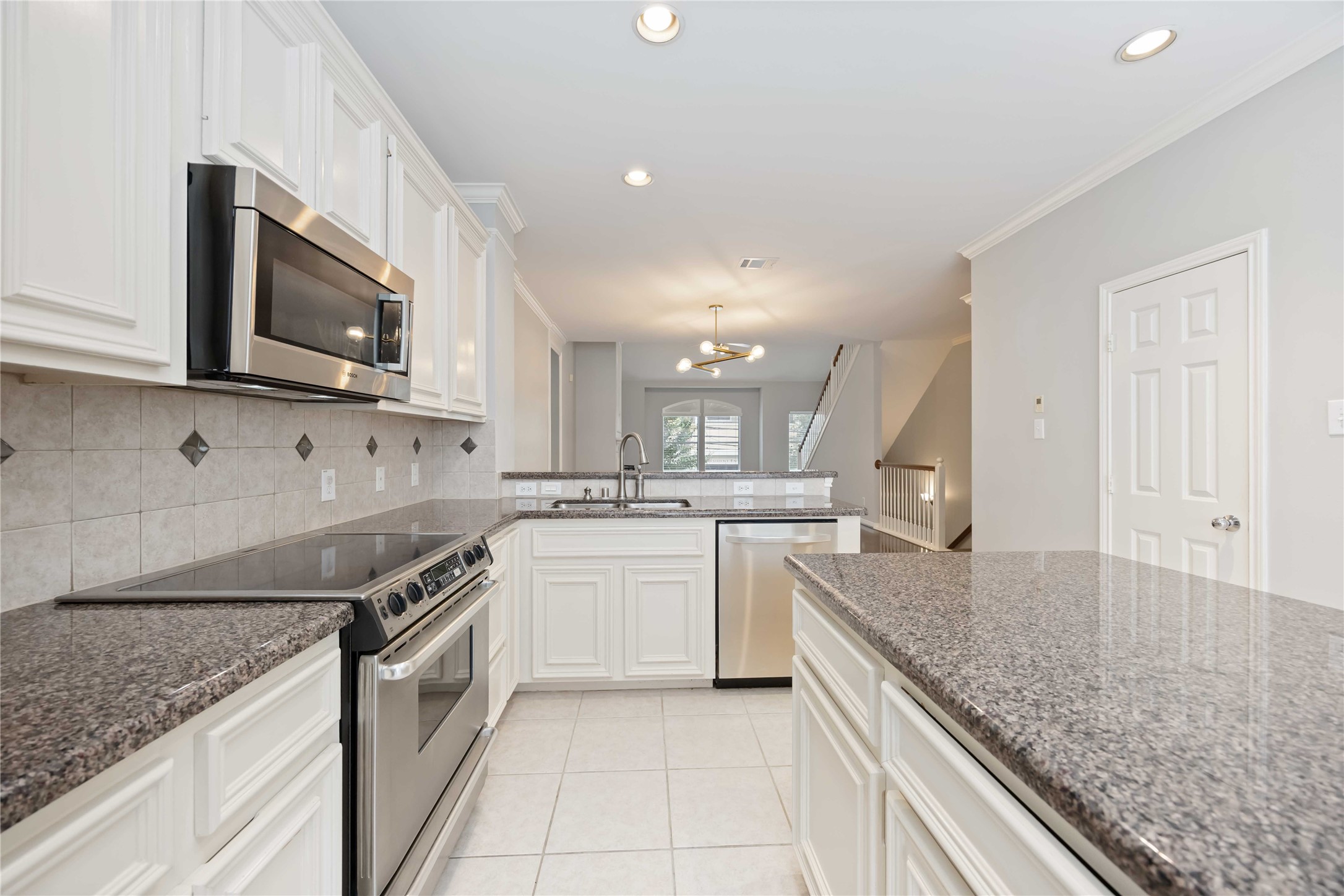 2909 West Dallas Street Houston, TX 77019 - Photo 20 of 39 a kitchen with stainless steel appliances granite countertop a sink stove and microwave