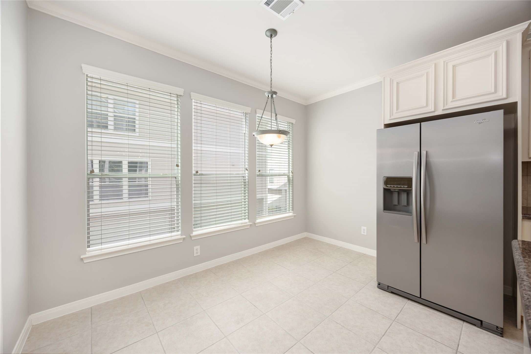 2909 West Dallas Street Houston, TX 77019 - Photo 24 of 39 a view of a kitchen with a refrigerator and microwave