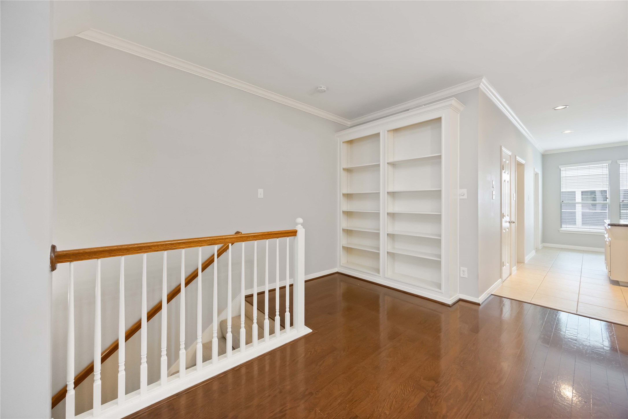 2909 West Dallas Street Houston, TX 77019 - Photo 7 of 39 a view of a hallway with wooden floor and stairs