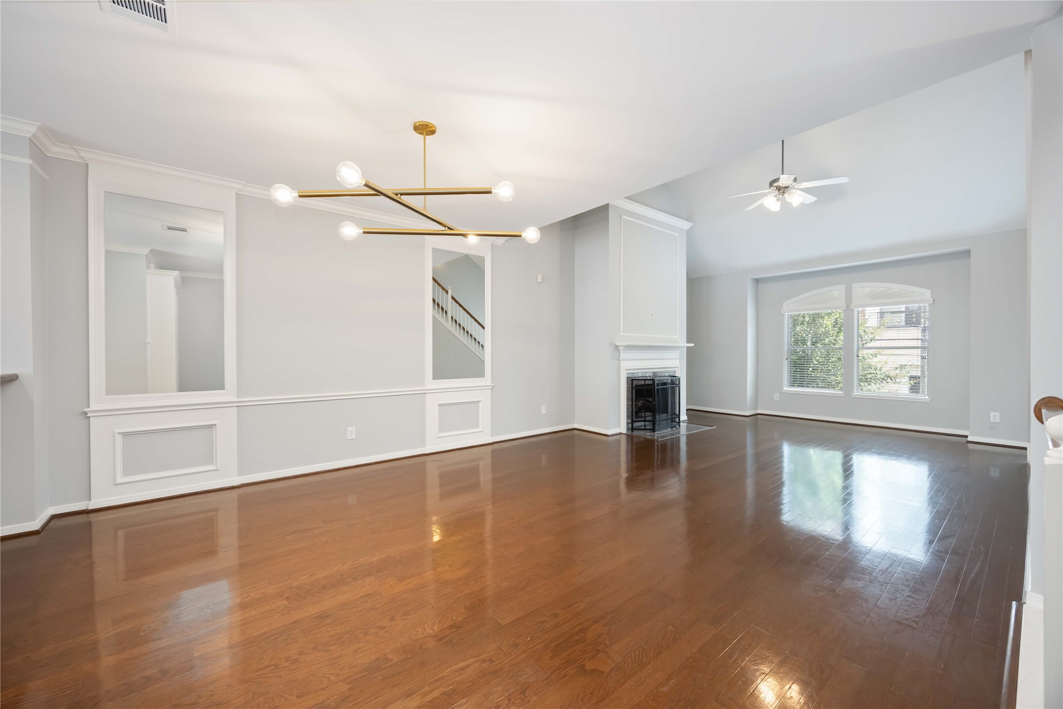 2909 West Dallas Street Houston, TX 77019 - Photo 9 of 39 a view of an empty room with window and wooden floor