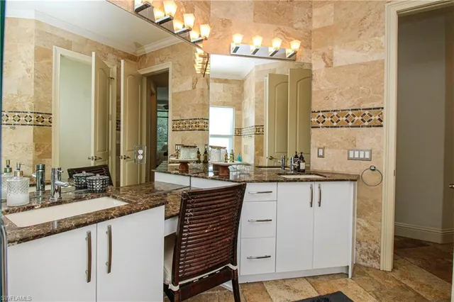 a bedroom with a bed window and a dresser