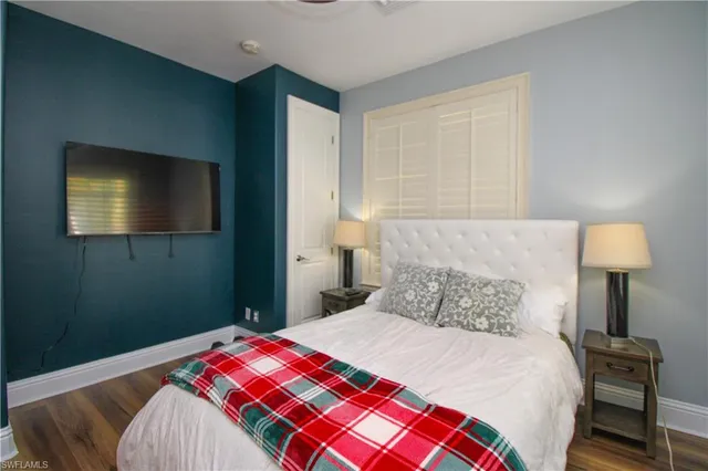 a view of a room with a mirror and windows