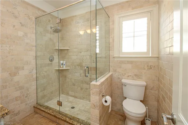 a spacious bedroom with a bed and a couch