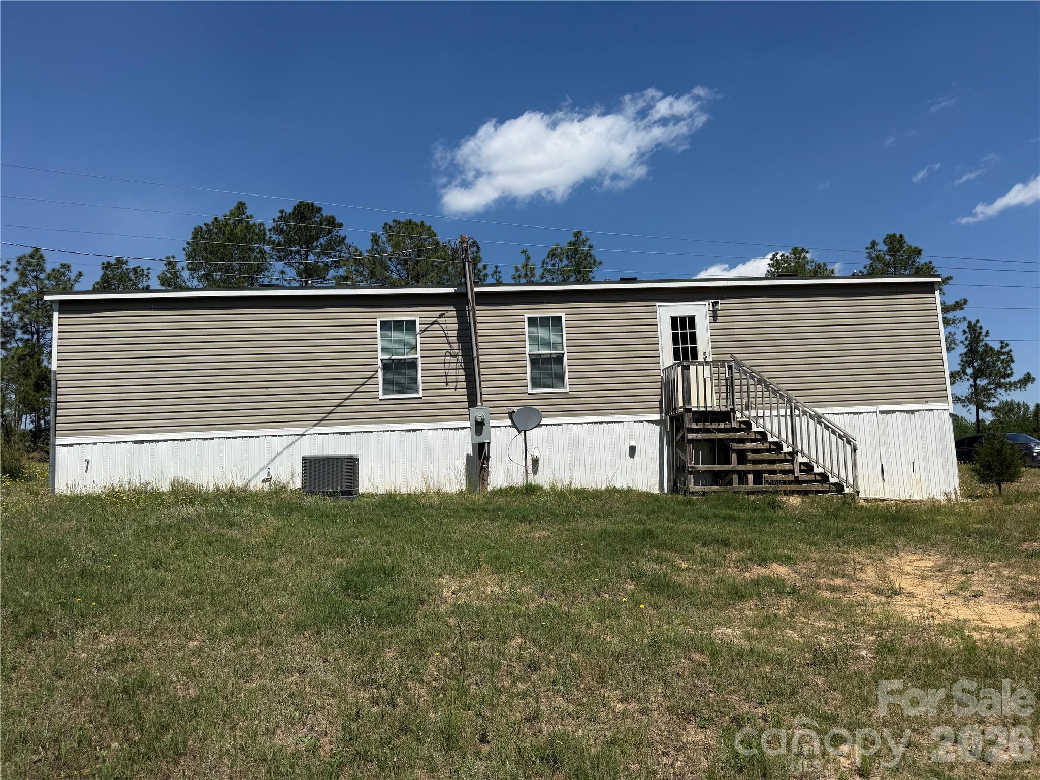 2640 Old Wire Road West Wallace, SC 29596 - Photo 3 of 18 a view of a house with a yard