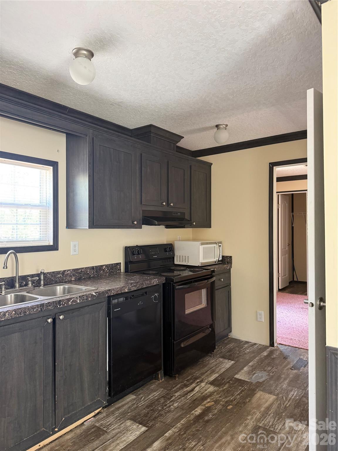 2640 Old Wire Road West Wallace, SC 29596 - Photo 7 of 18 a kitchen with stainless steel appliances granite countertop a stove a sink and a microwave