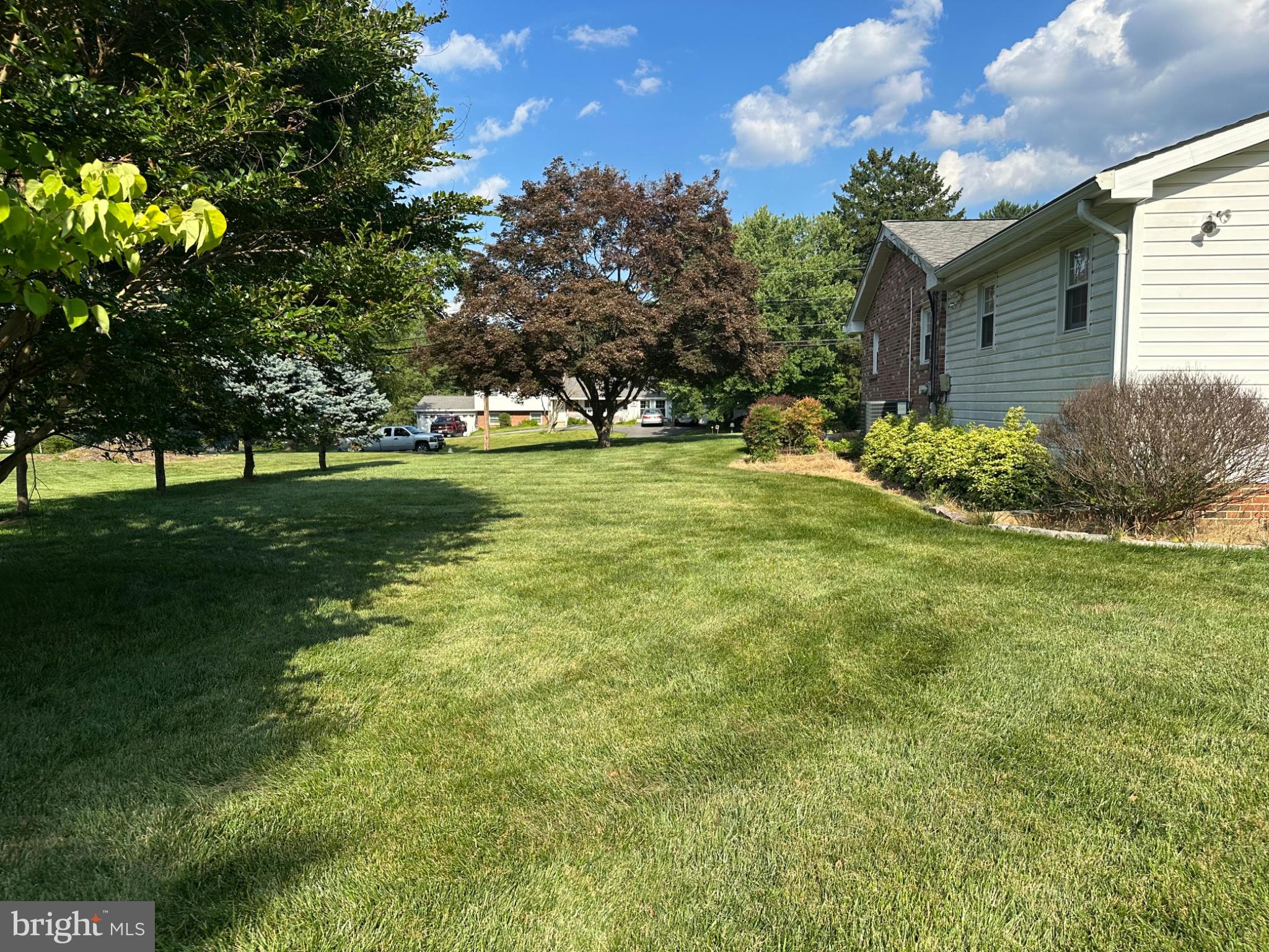 14616 Sturtevant Road Silver Spring, MD 20905 - Photo 36 of 44 Lush green lawn under sunny skies.