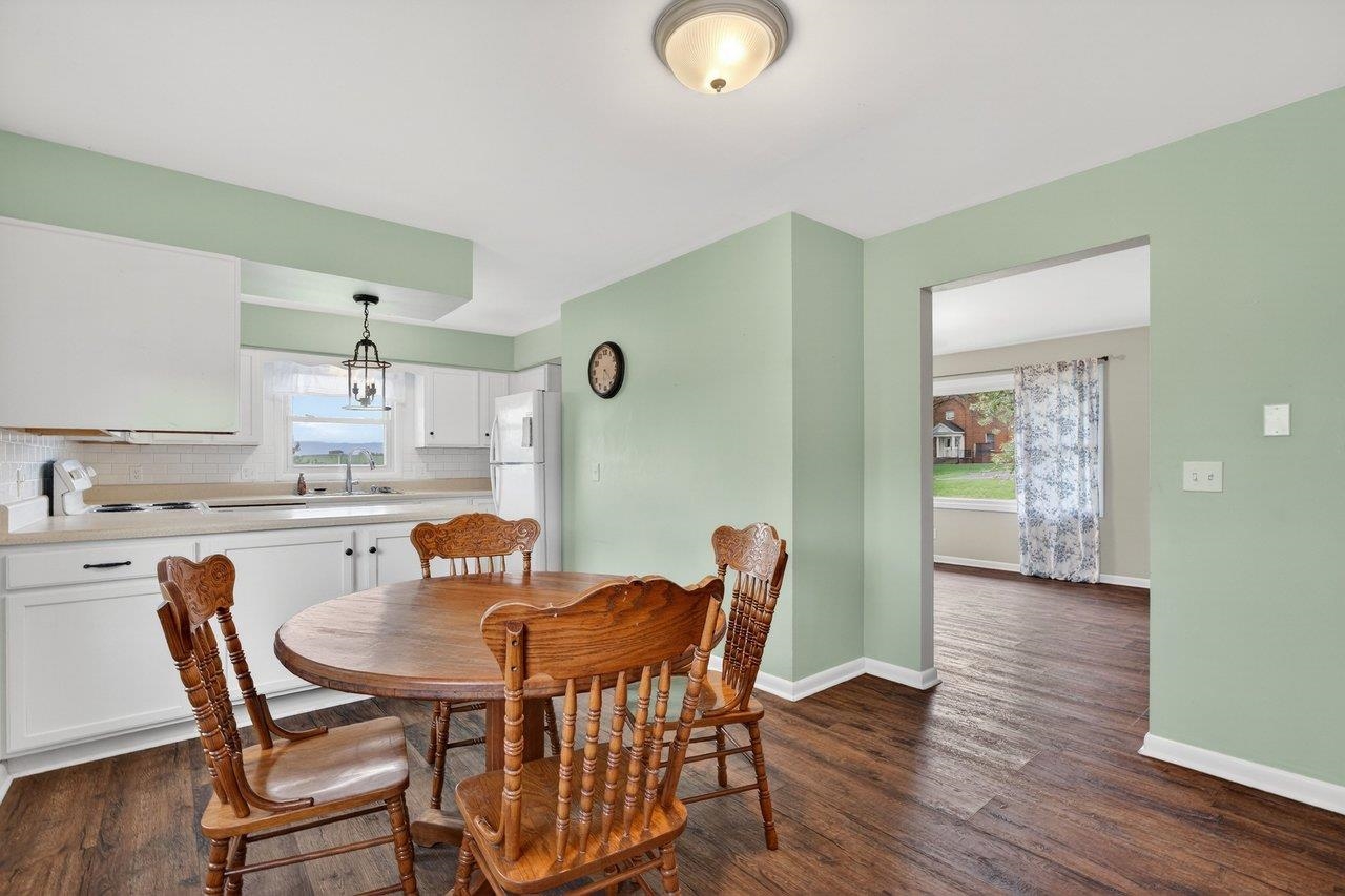 3259 Zion Church Road Broadway, VA 22815 - Photo 8 of 48 a dining room with furniture and wooden floor