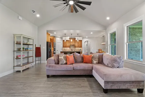 a living room with furniture and a large window