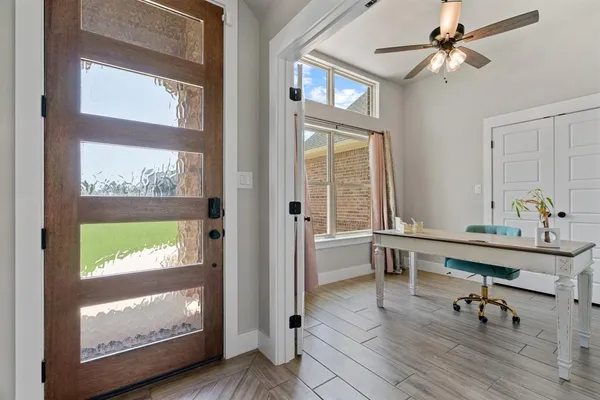 a view of a livingroom with furniture and a window