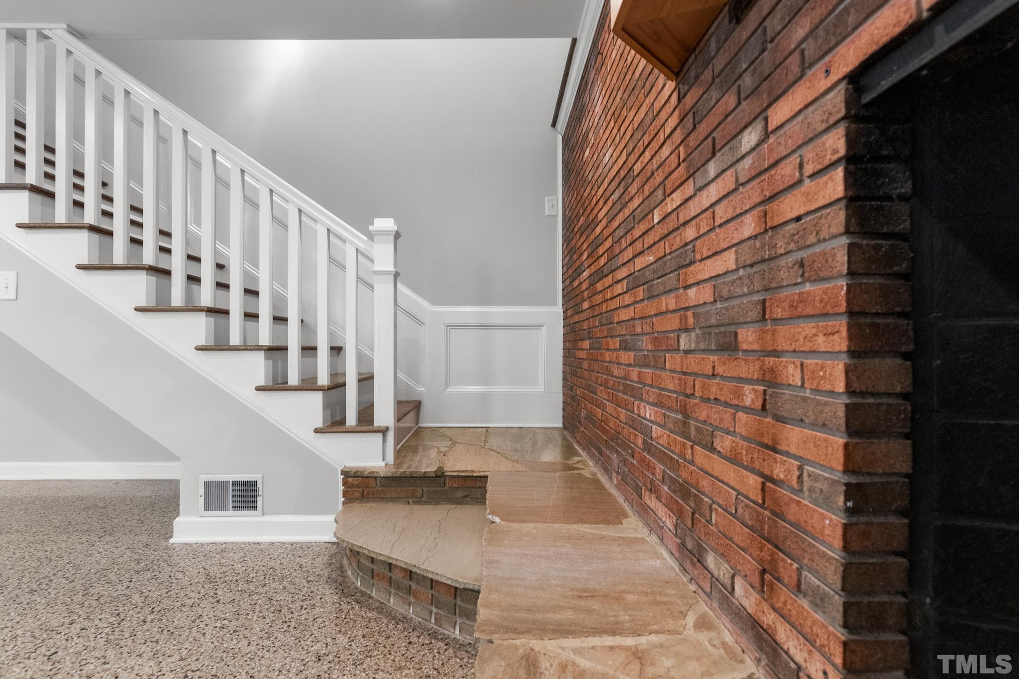 6630 Winding Trail Raleigh, NC 27612 - Photo 15 of 33 a view of entryway with wooden floor