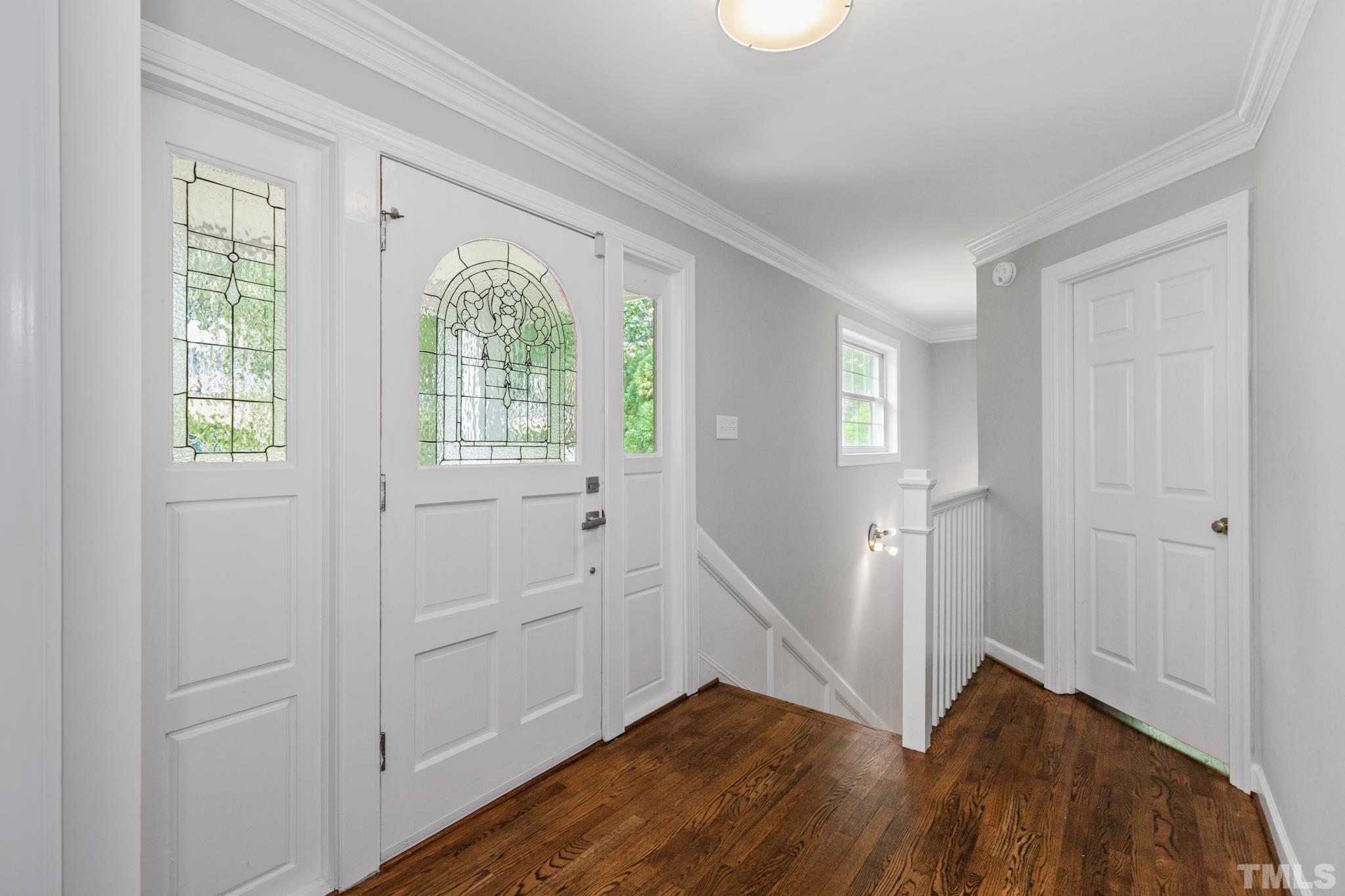 6630 Winding Trail Raleigh, NC 27612 - Photo 17 of 33 a view of entryway with wooden floor