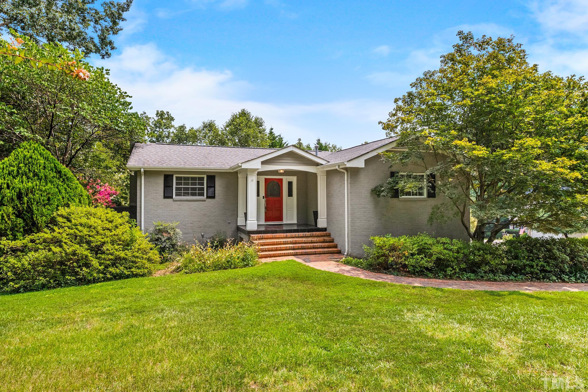 6630 Winding Trail Raleigh, NC 27612 - Photo 2 of 33 a front view of a house with garden
