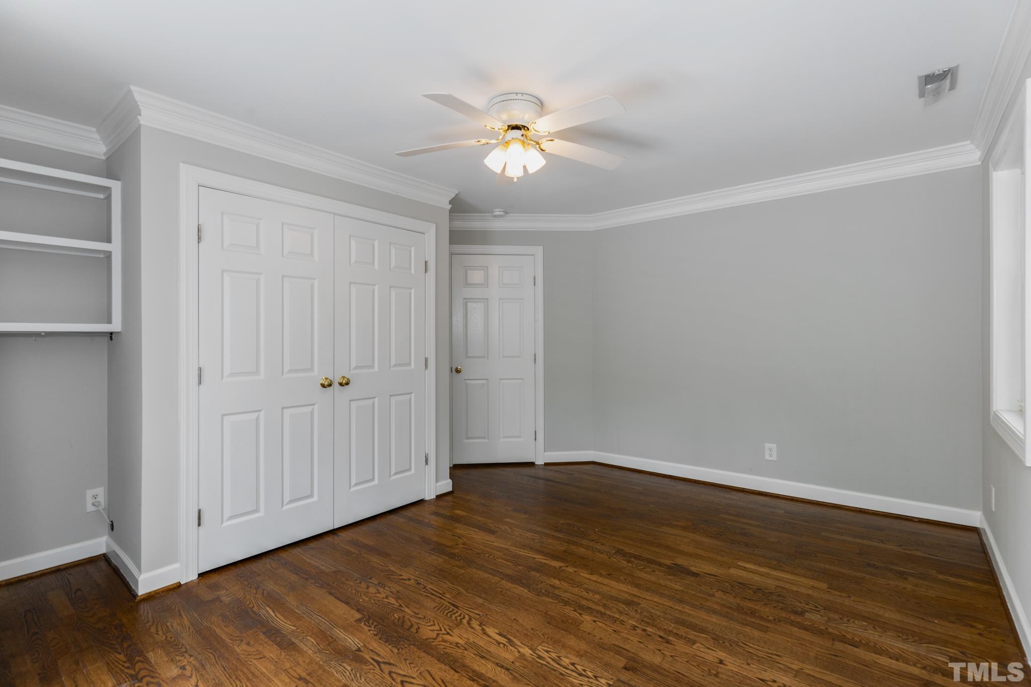 6630 Winding Trail Raleigh, NC 27612 - Photo 25 of 33 a view of an empty room with wooden floor