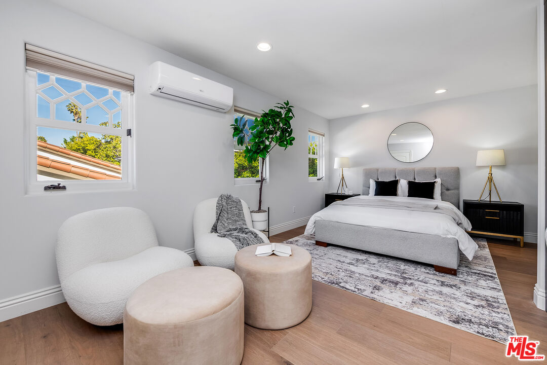 4359 Clybourn Avenue Toluca Lake, CA 91602 - Photo 30 of 45 a bedroom with a bed and a couch