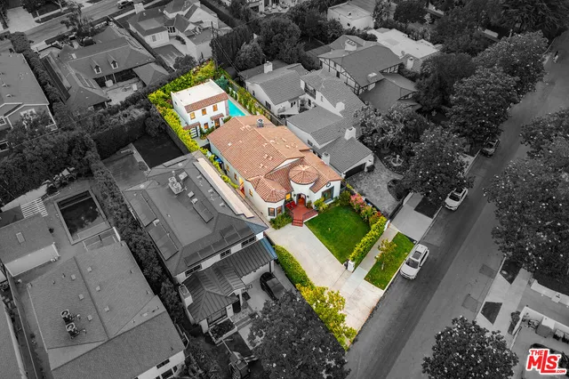 an aerial view of a house with a garden