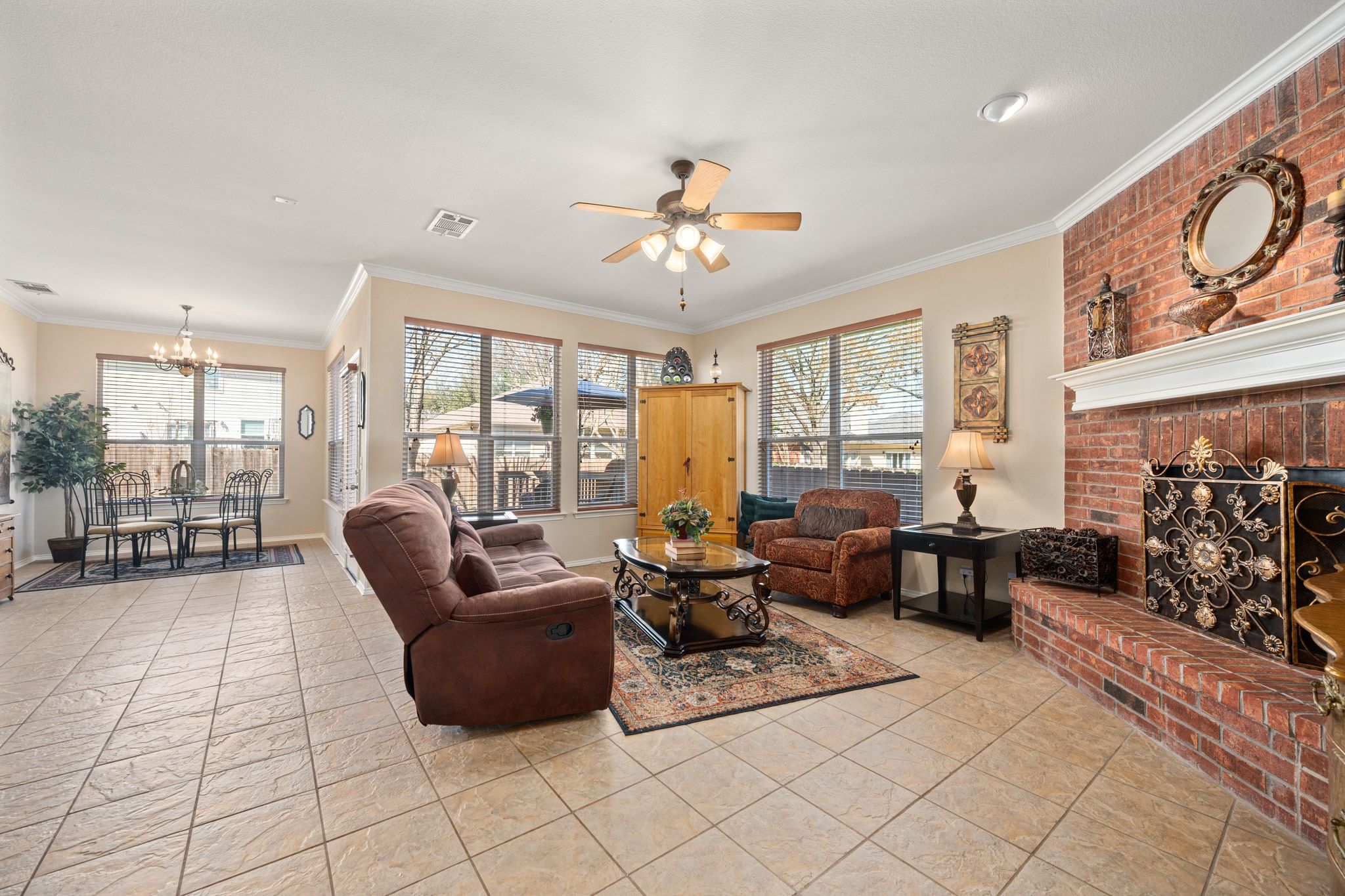 3312 Marin Court Austin, TX 78738 - Photo 13 of 40 The back of the home opens to a bright family room, kitchen, and dining nook lined with windows overlooking the backyard.