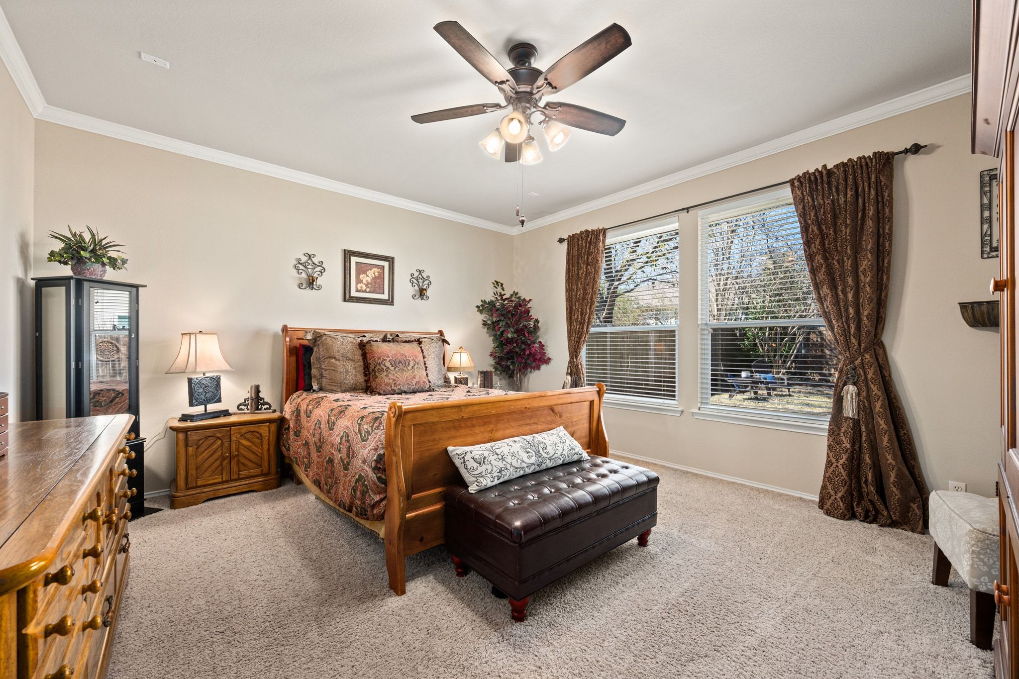 3312 Marin Court Austin, TX 78738 - Photo 19 of 40 The primary suite is a spacious and secluded retreat tucked away at the back of the home overlooking the backyard.