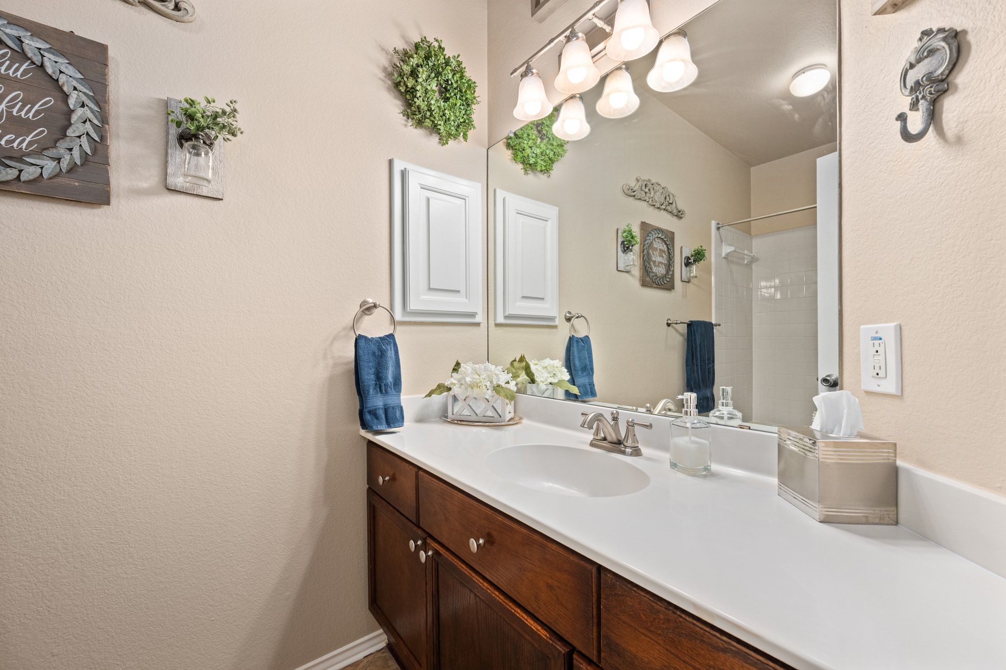 3312 Marin Court Austin, TX 78738 - Photo 25 of 40 The full secondary bathroom is located between the secondary bedrooms and comes with a spacious single vanity and shower/tub combo.