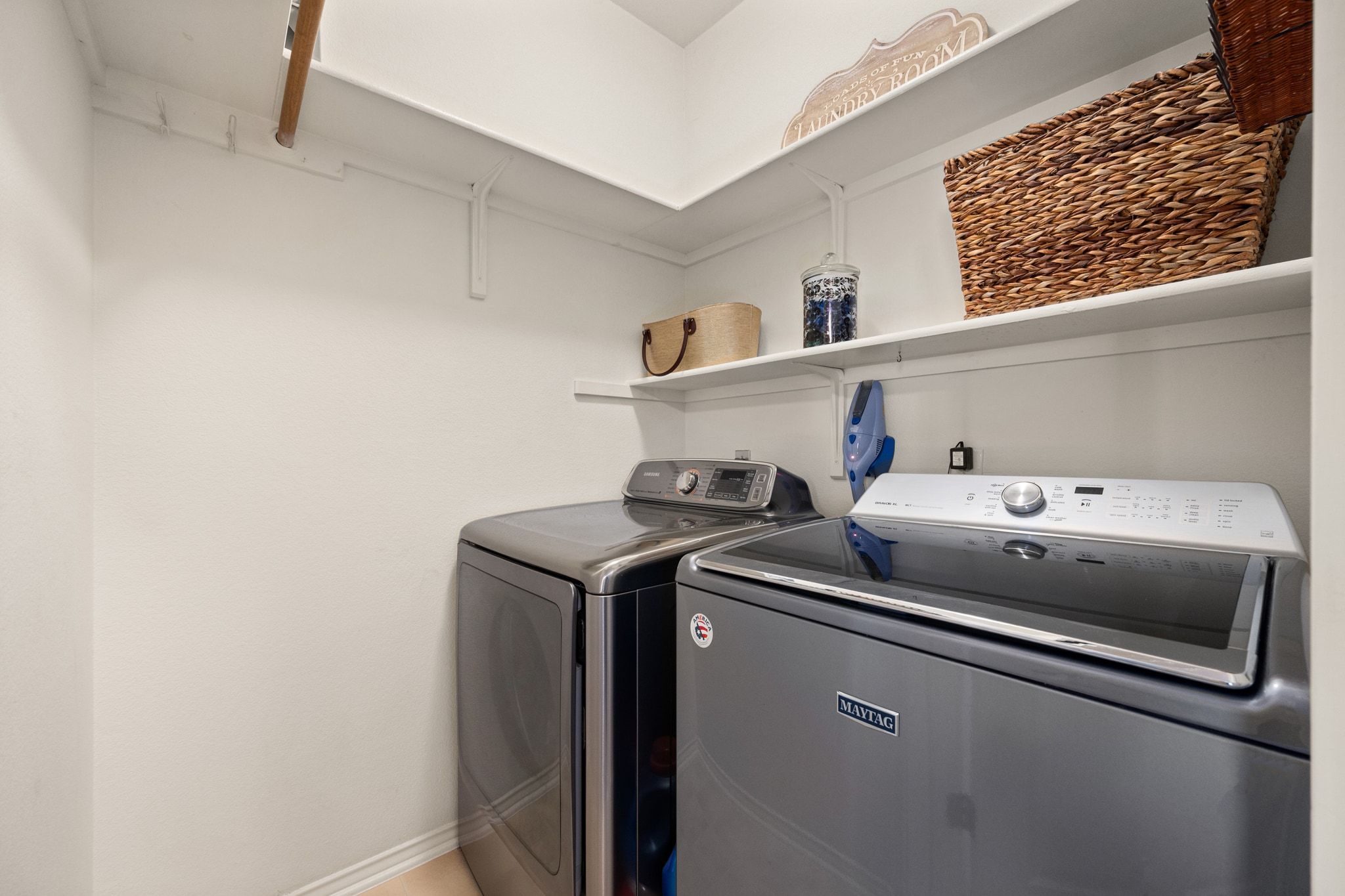 3312 Marin Court Austin, TX 78738 - Photo 26 of 40 The in home laundry room is lined with shelves and offers hanging storage.