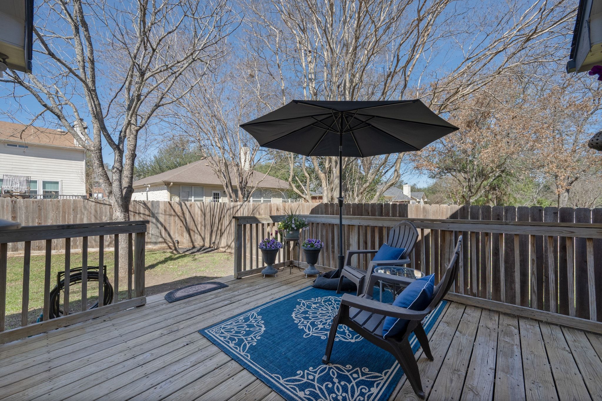 3312 Marin Court Austin, TX 78738 - Photo 27 of 40 Your living space extends outdoors onto the private back deck with space for outdoor living, dining, and your grill station.