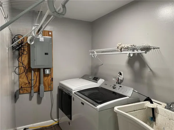 a utility room with dryer and washer