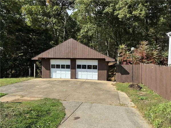 a house with trees in the background