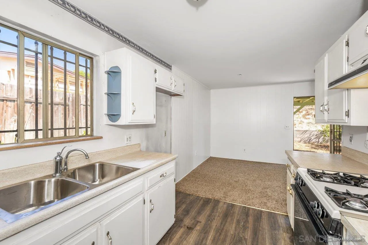4112 Lewis Street Oceanside, CA 92056 - Photo 11 of 36 a kitchen that has a sink and a stove