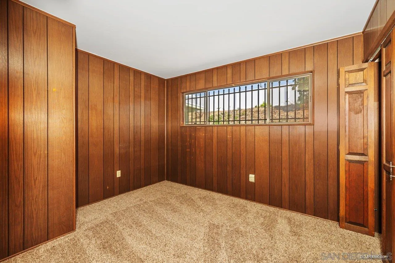 4112 Lewis Street Oceanside, CA 92056 - Photo 18 of 36 a view of a livingroom with a wooden door
