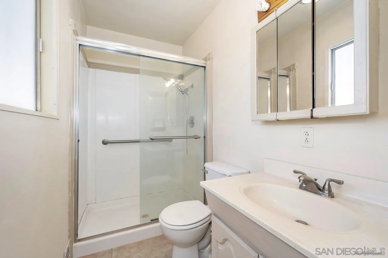4112 Lewis Street Oceanside, CA 92056 - Photo 24 of 36 a bathroom with a sink toilet and shower