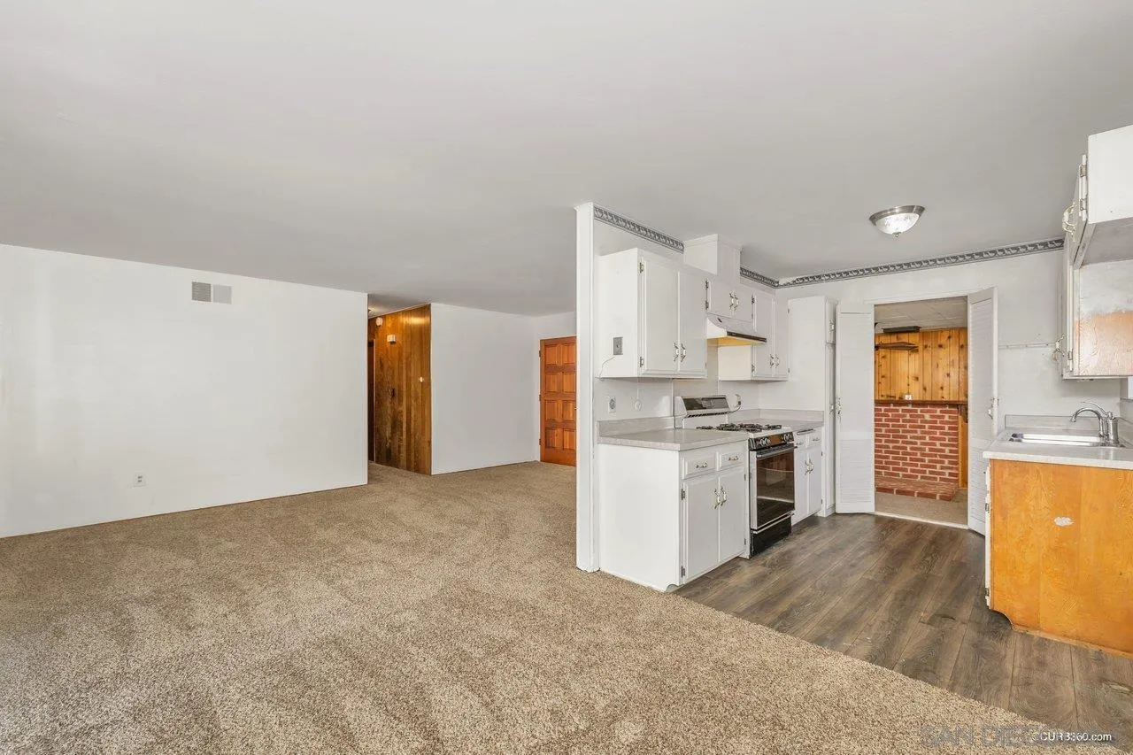 4112 Lewis Street Oceanside, CA 92056 - Photo 3 of 36 a view of a kitchen with wooden floor