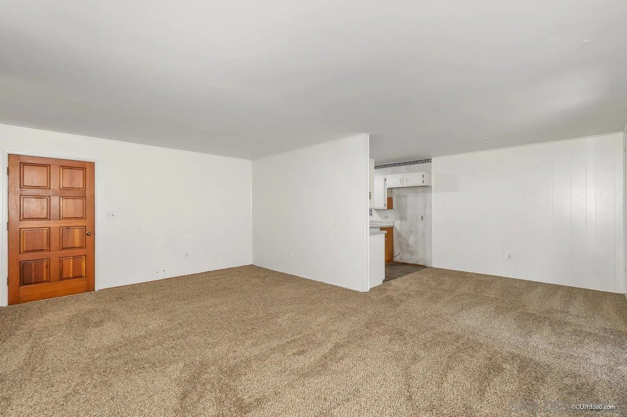 4112 Lewis Street Oceanside, CA 92056 - Photo 5 of 36 a view of an empty room and a kitchen