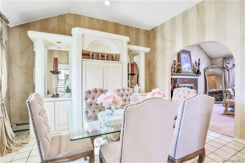 2 Split Tree Drive New Windsor, NY 12553 - Photo 14 of 36 Dining space with light tile patterned floors and a baseboard radiator