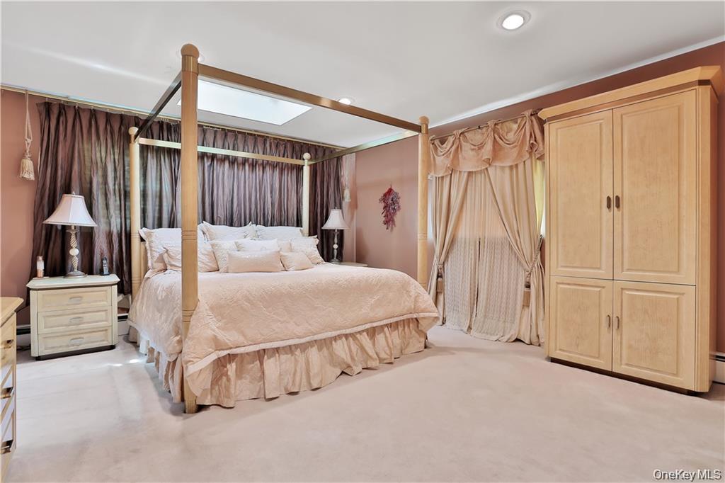 2 Split Tree Drive New Windsor, NY 12553 - Photo 22 of 36 Bedroom featuring a skylight, light carpet, and recessed lighting