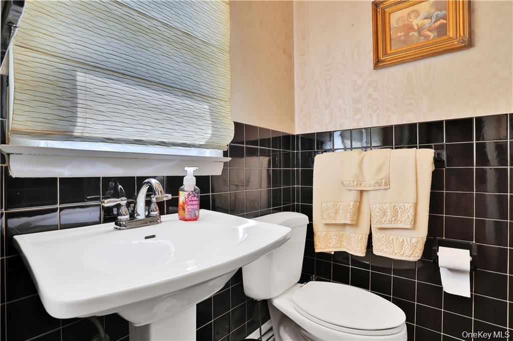 2 Split Tree Drive New Windsor, NY 12553 - Photo 27 of 36 Bathroom featuring tile walls and toilet