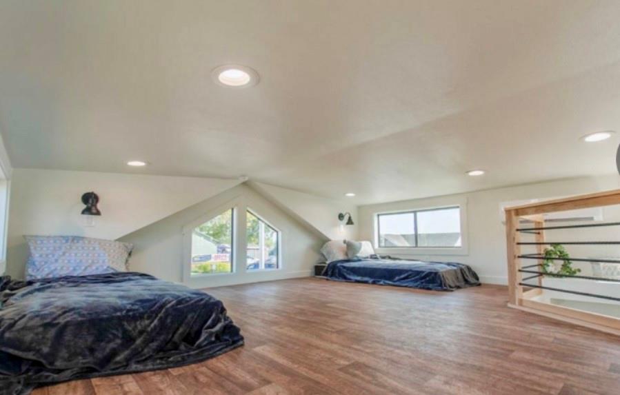 3235 County Road Cookville, TX 75558 - Photo 22 of 37 a spacious bedroom with a bed and a large window