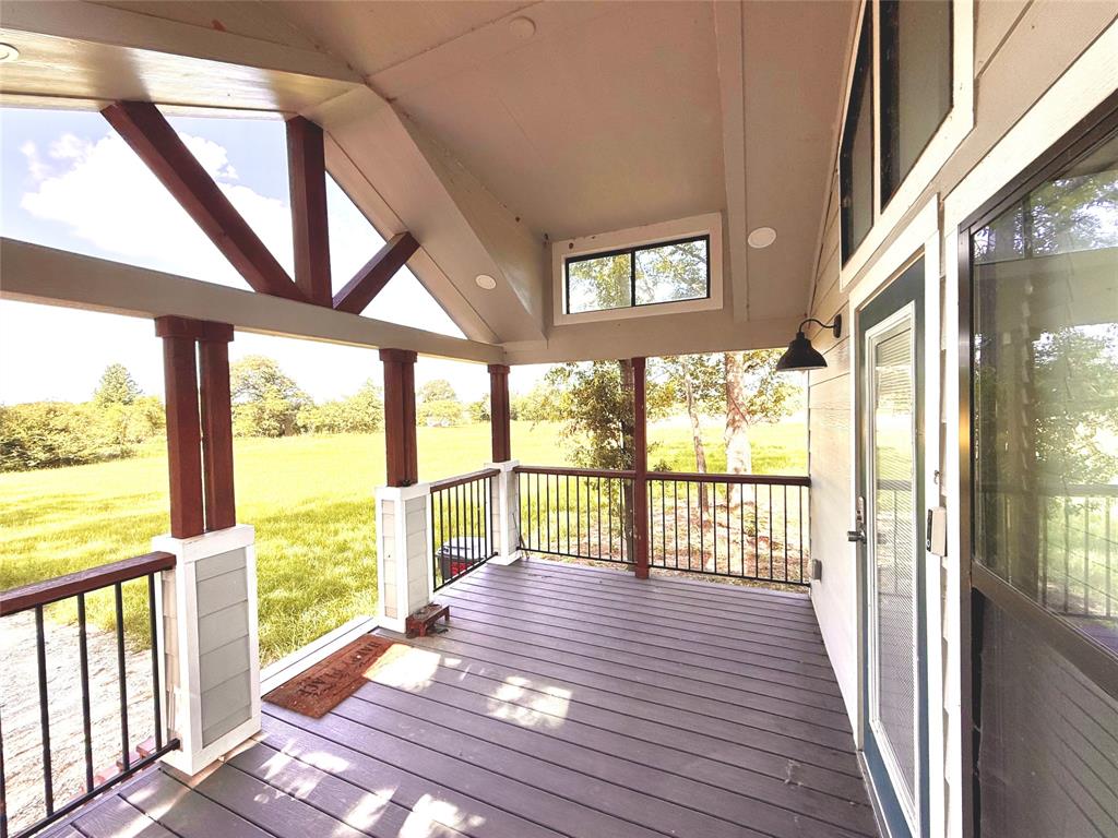 3235 County Road Cookville, TX 75558 - Photo 23 of 37 a view of a porch with wooden floor