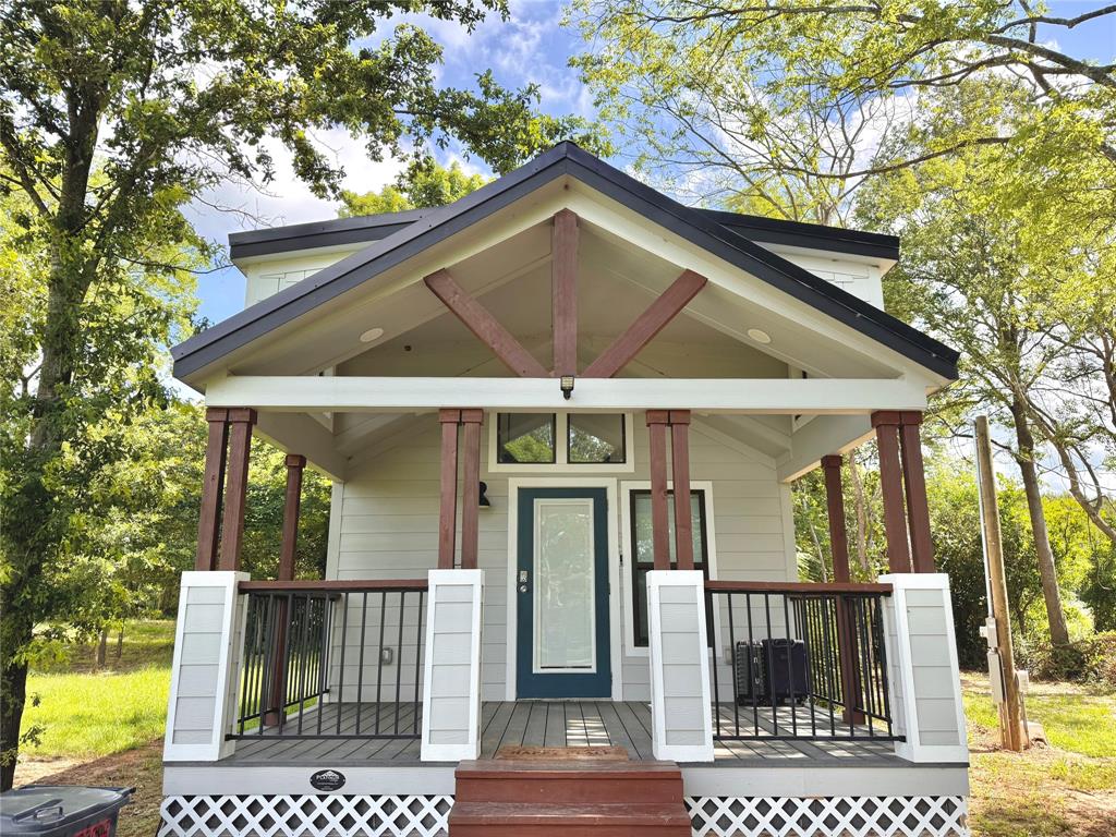 3235 County Road Cookville, TX 75558 - Photo 24 of 37 a view of a brick house with large windows